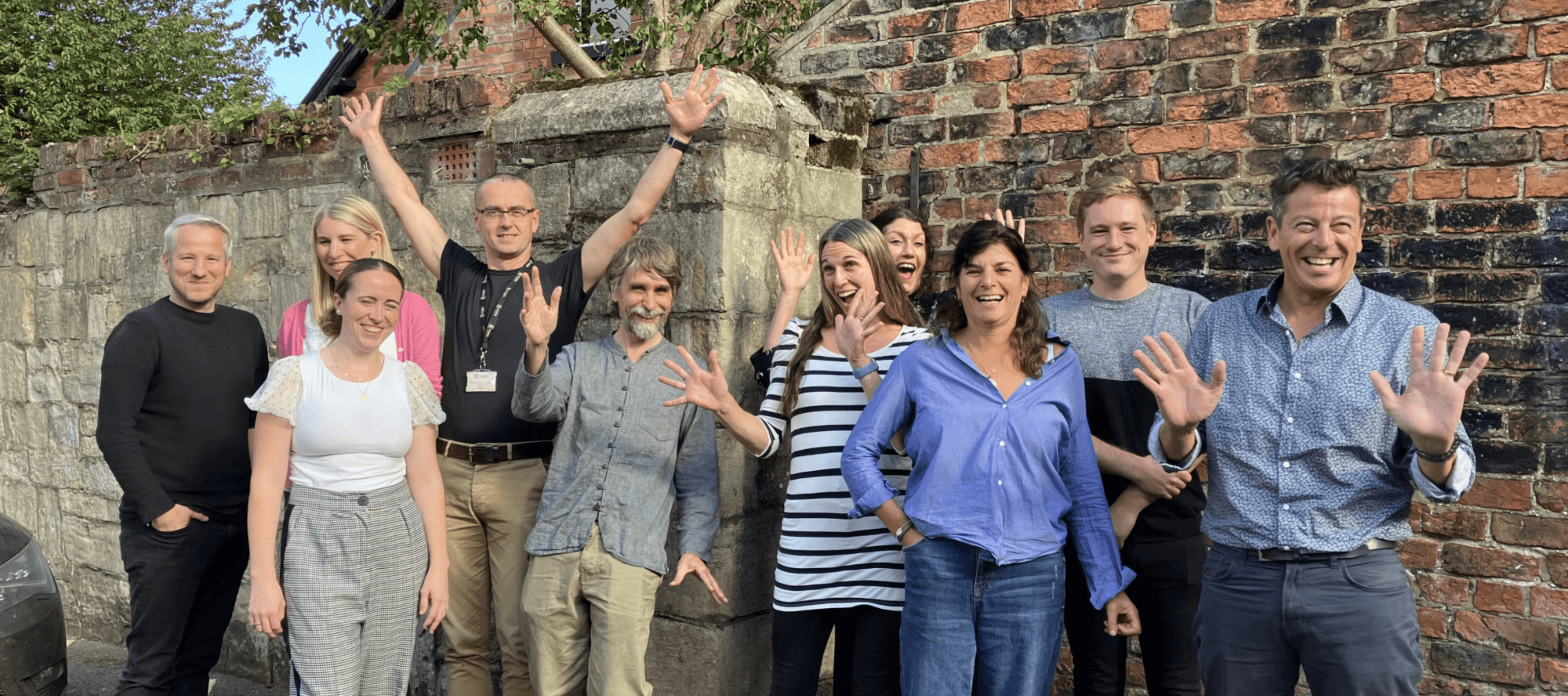 Group of people from York doing jazz hands