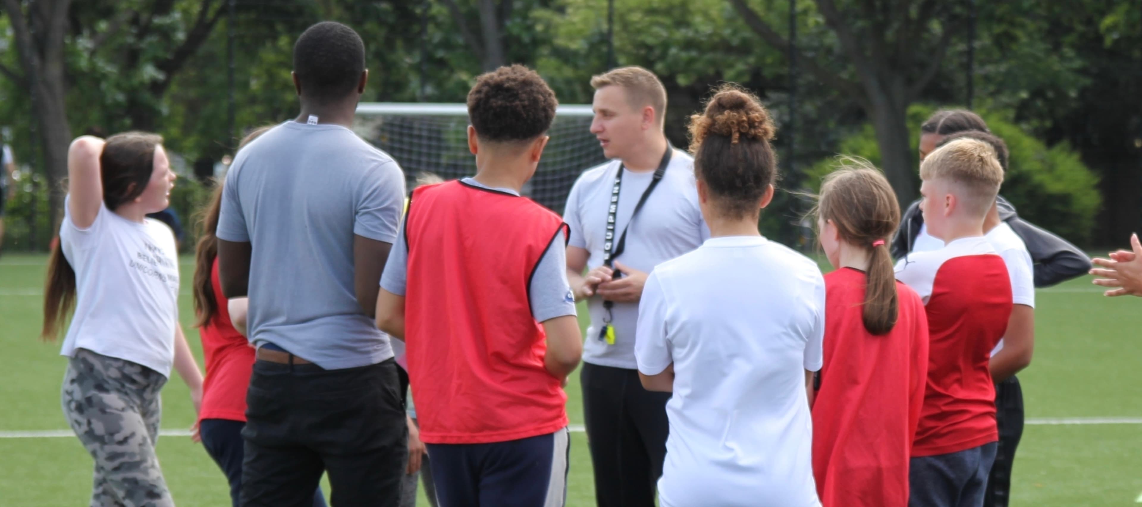 Teenagers playing football